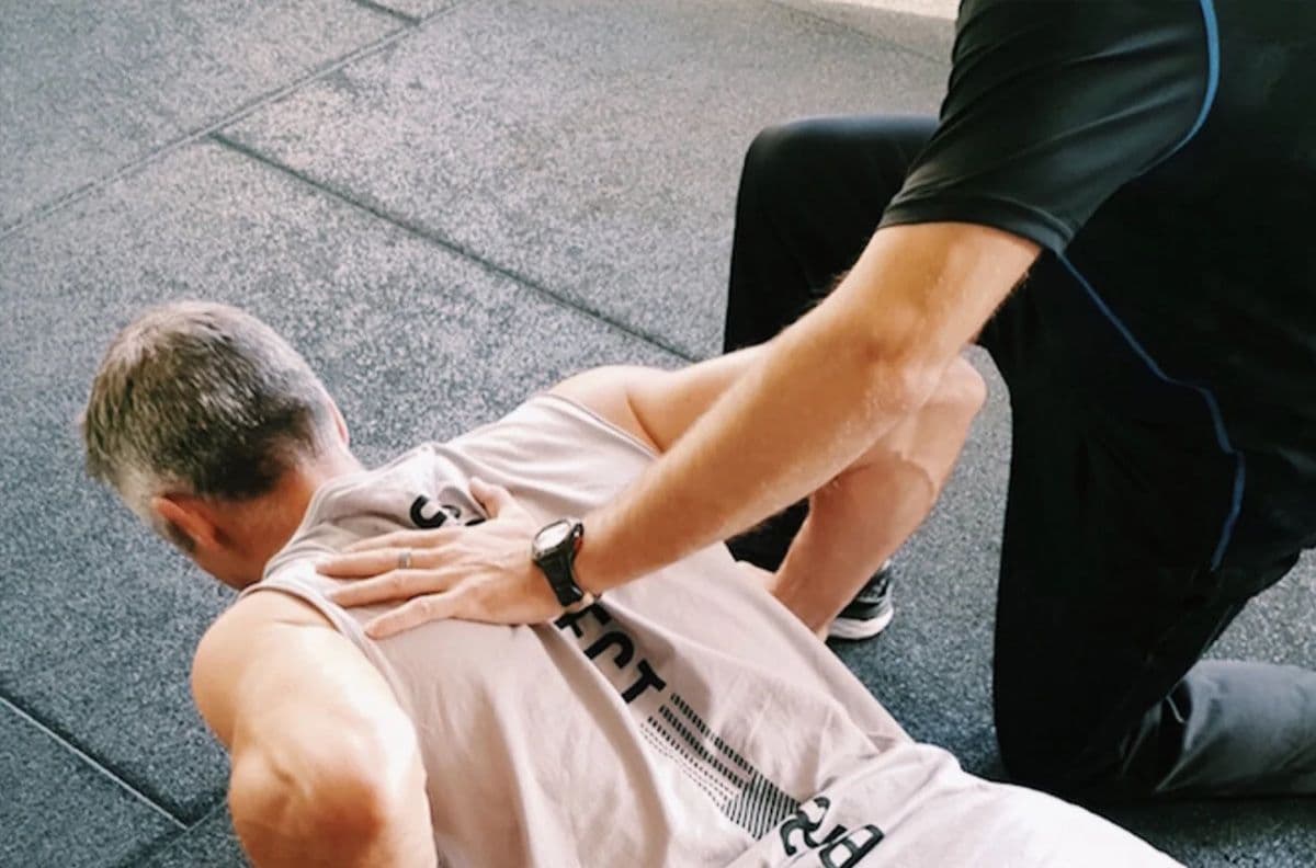 Personal trainer coaching a client at Shape Shifters